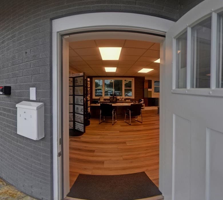 The showroom's front door standing open, looking through to the design desk and hardware displays inside.